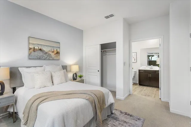 a bedroom with a bed and a view of bedroom