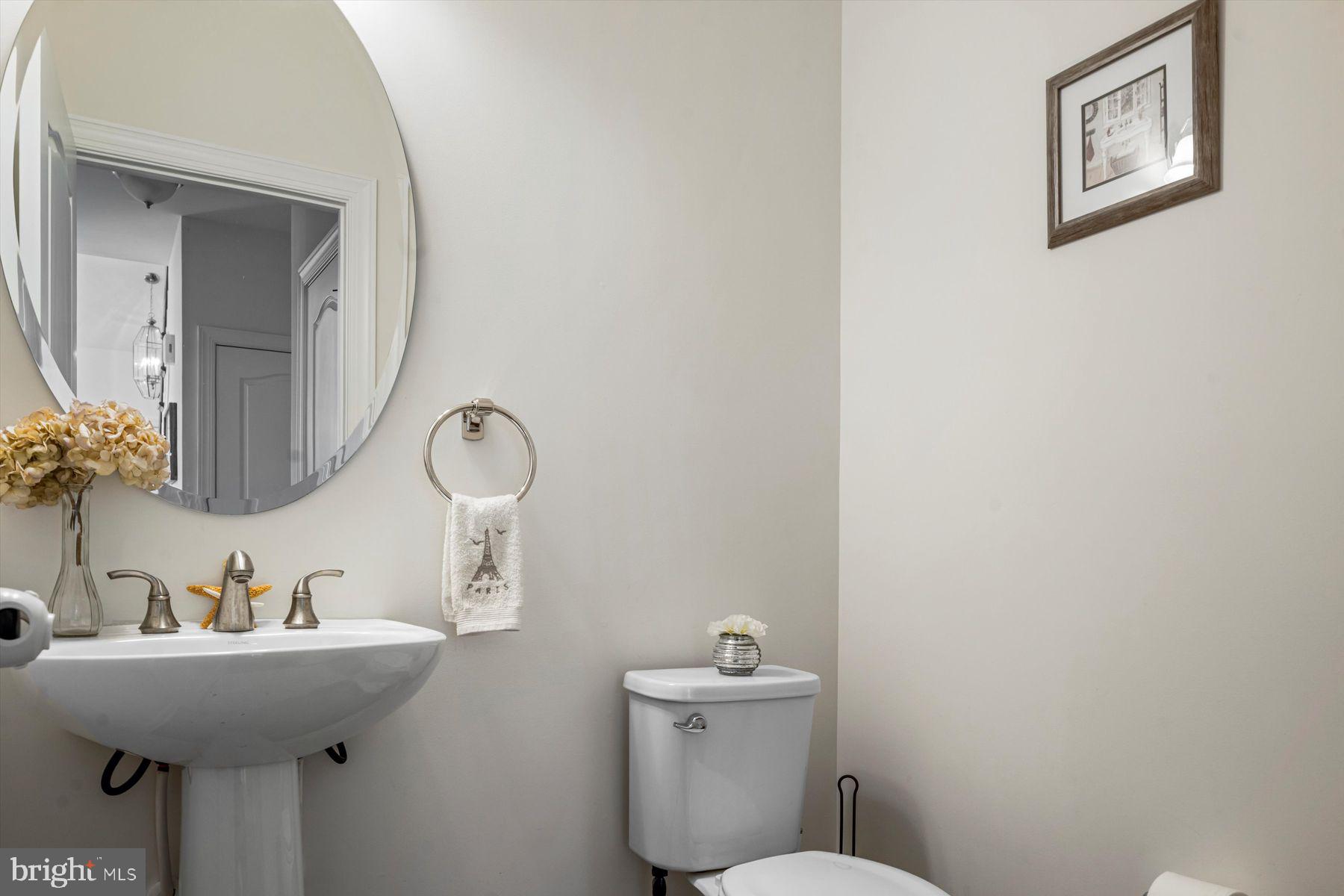 91 Lilac Road Malvern, PA 19355 - Photo 13 of 34 a bathroom with a toilet sink and mirror