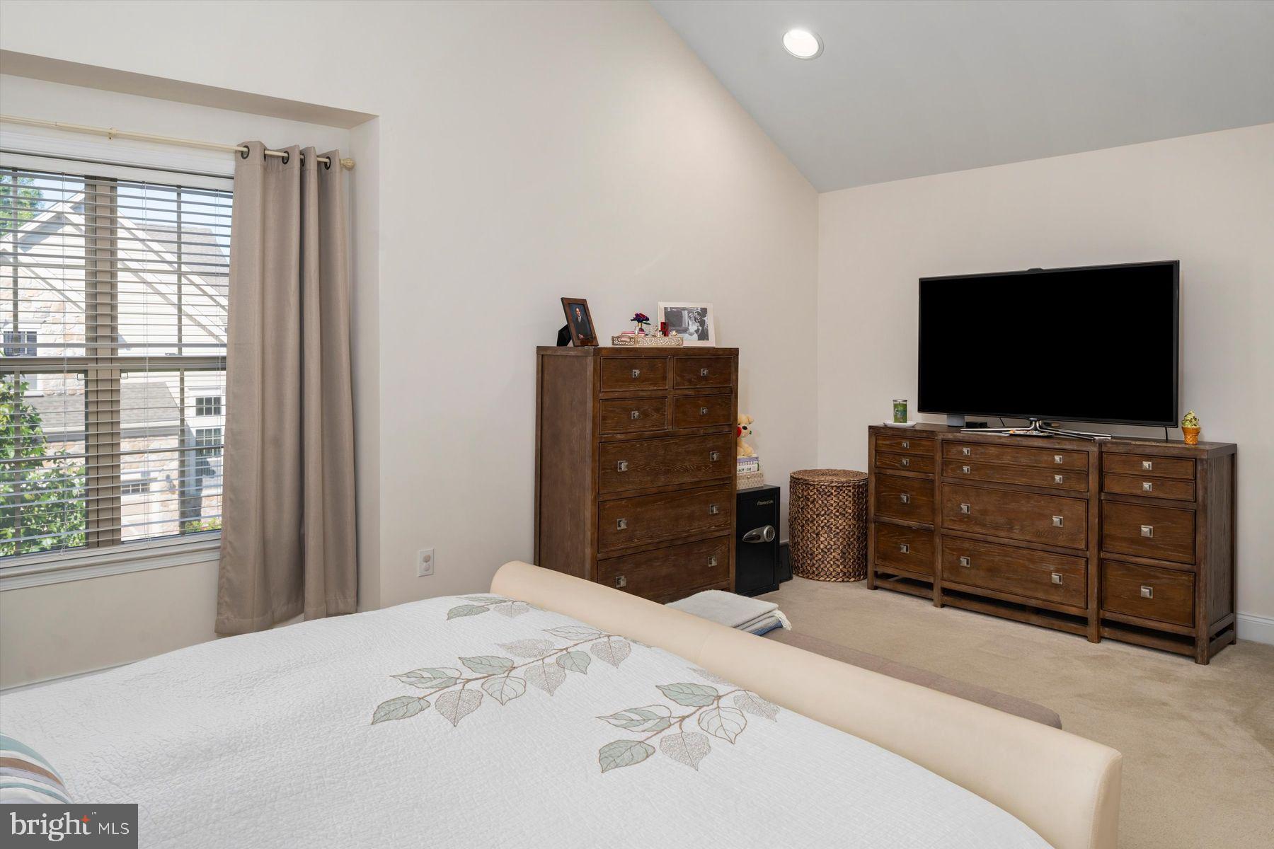 91 Lilac Road Malvern, PA 19355 - Photo 15 of 34 a bedroom with a bed and a flat screen tv