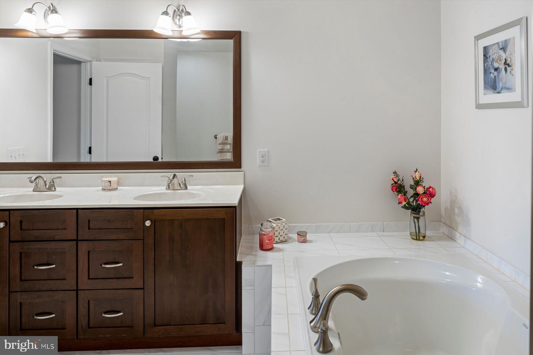 91 Lilac Road Malvern, PA 19355 - Photo 17 of 34 a bathroom with a sink vanity and a mirror