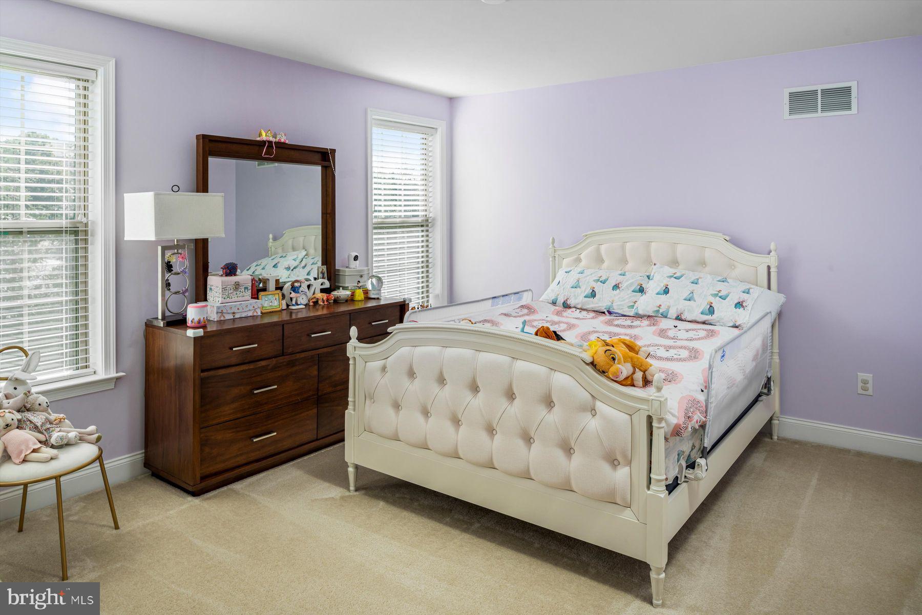 91 Lilac Road Malvern, PA 19355 - Photo 20 of 34 a bed room with a bed and a dresser