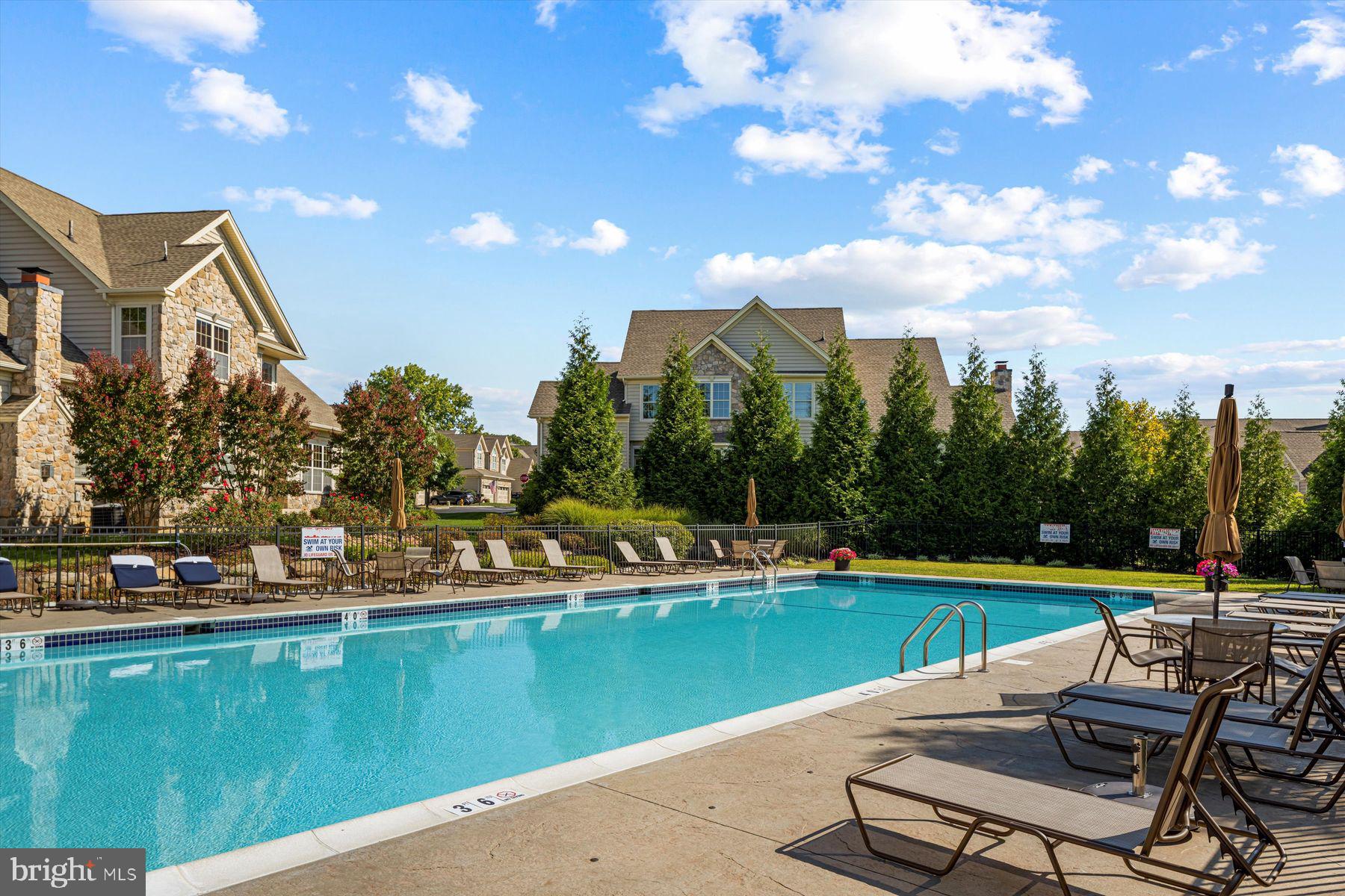 91 Lilac Road Malvern, PA 19355 - Photo 25 of 34 a view of a swimming pool and lounge chairs
