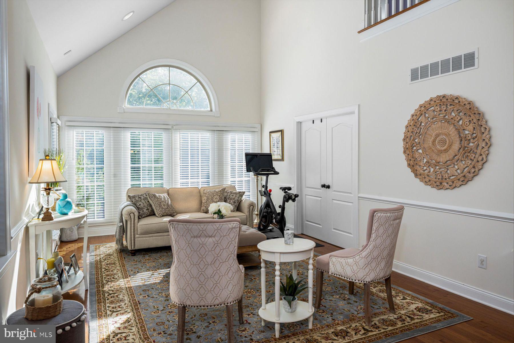 91 Lilac Road Malvern, PA 19355 - Photo 3 of 34 a living room with furniture a table and a large window