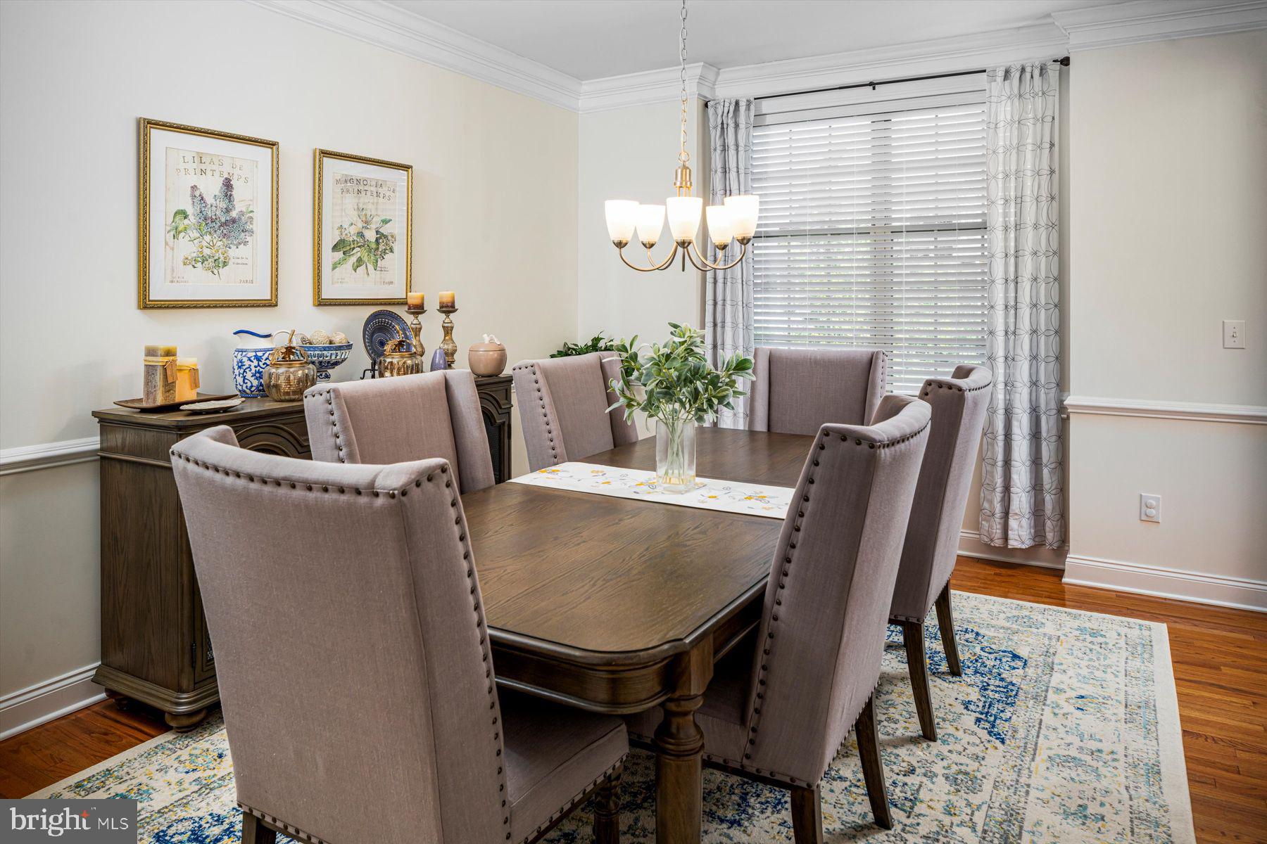 91 Lilac Road Malvern, PA 19355 - Photo 7 of 34 a view of a dining room with furniture and a chandelier