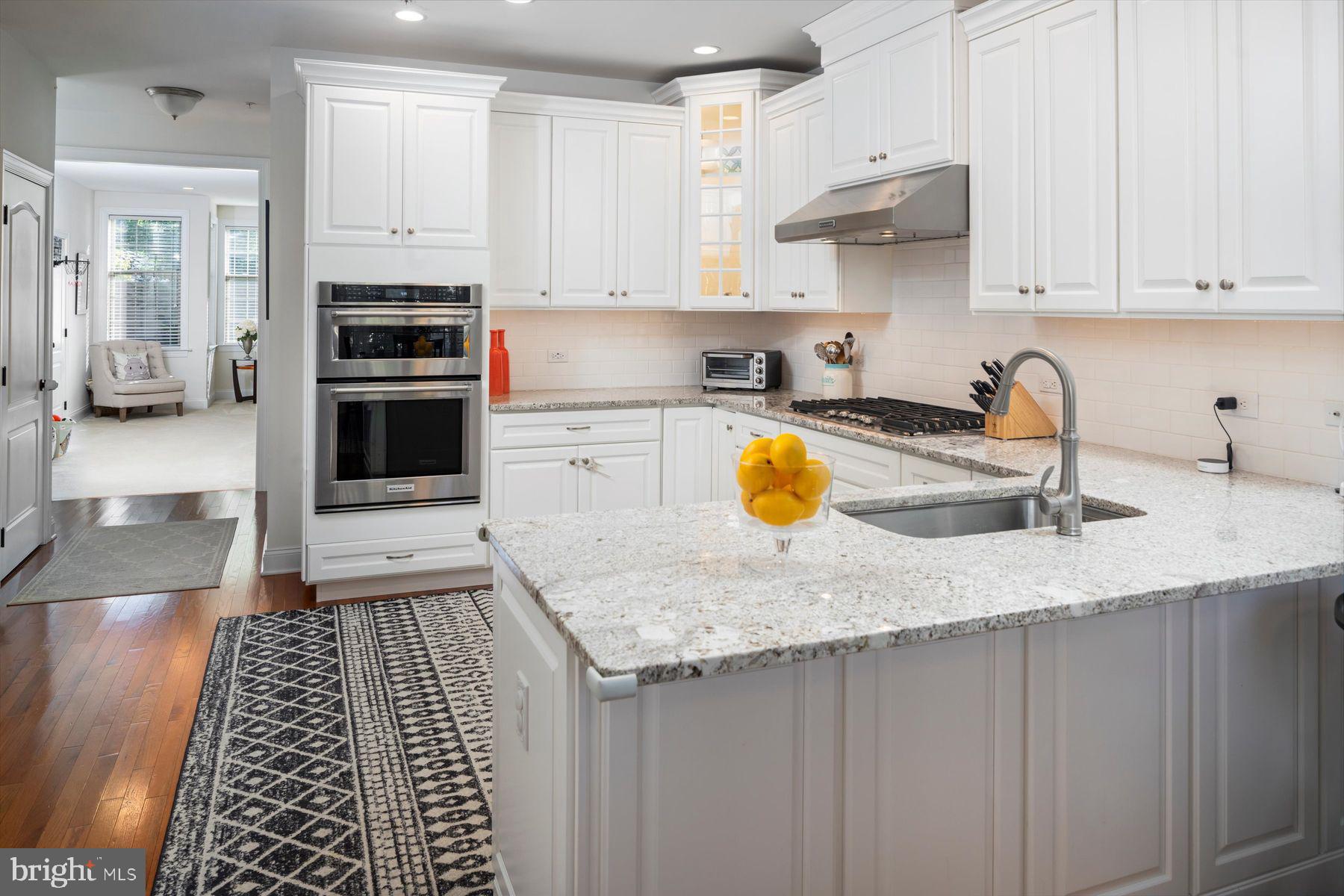 91 Lilac Road Malvern, PA 19355 - Photo 9 of 34 a kitchen with stainless steel appliances granite countertop a sink stove and refrigerator