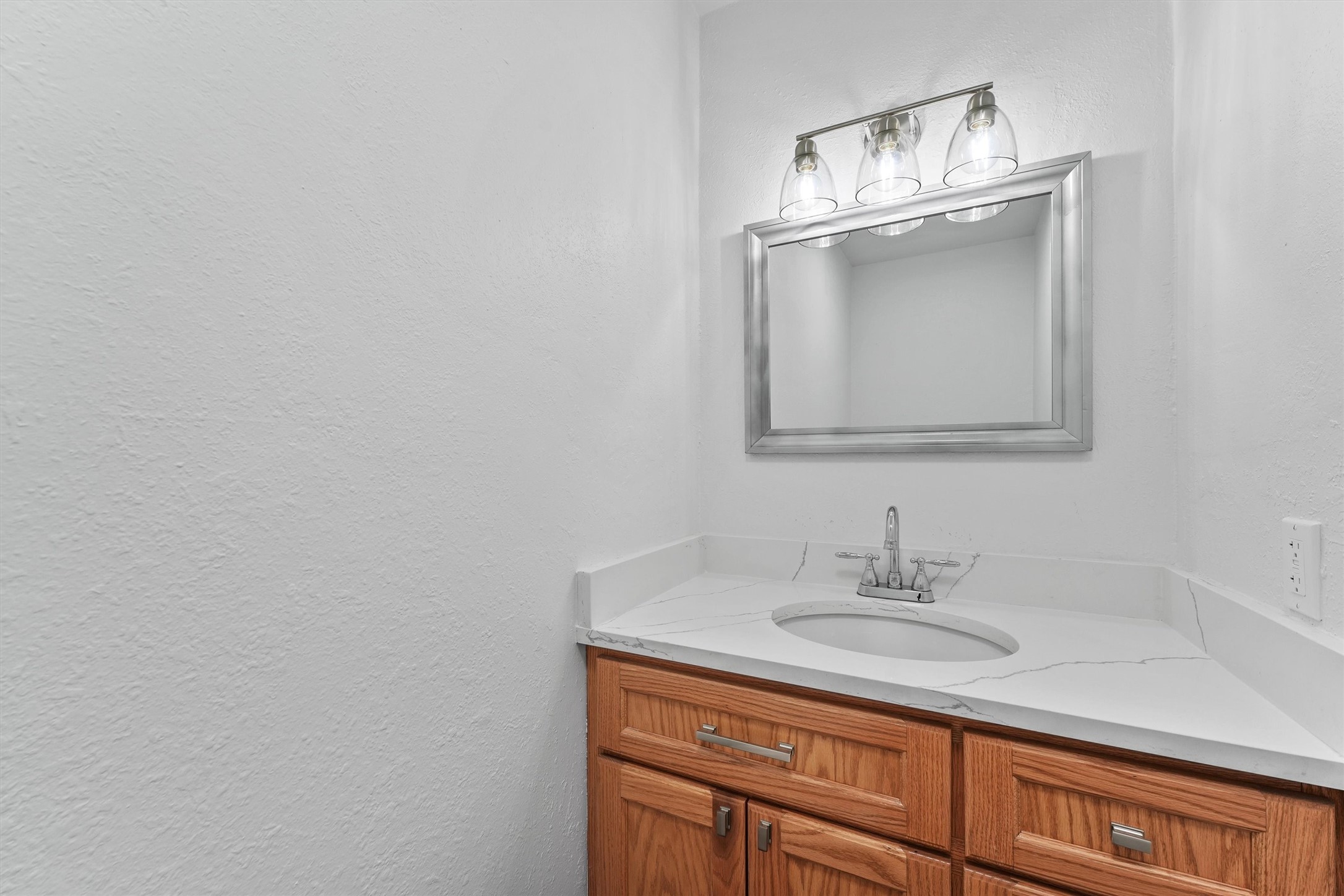 11550 Chimney Rock Road, Unit 536 Houston, TX 77035 - Photo 12 of 28 Half bath with quartz countertop on the 1st floor