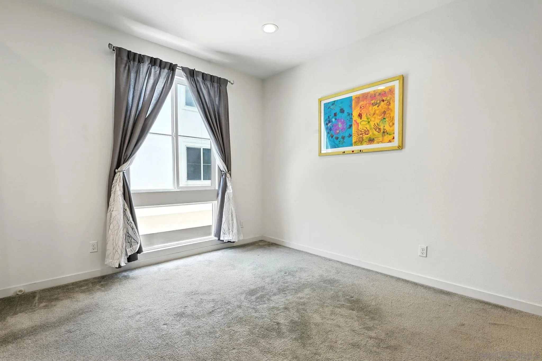 2275 Element Way, Unit 4 Chula Vista, CA 91915 - Photo 15 of 45 an empty room with windows and stairs