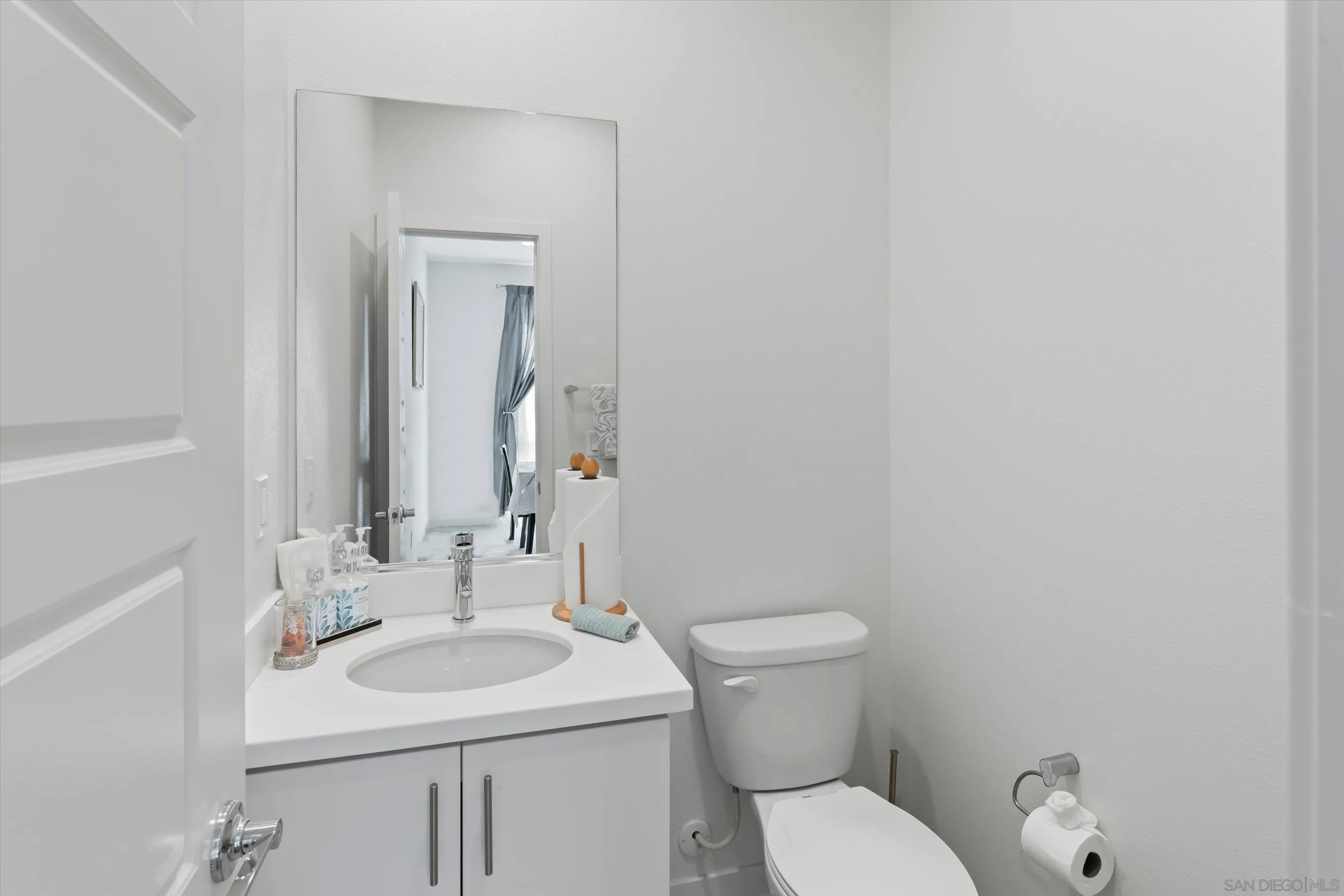 2275 Element Way, Unit 4 Chula Vista, CA 91915 - Photo 18 of 45 a bathroom with a toilet sink and mirror