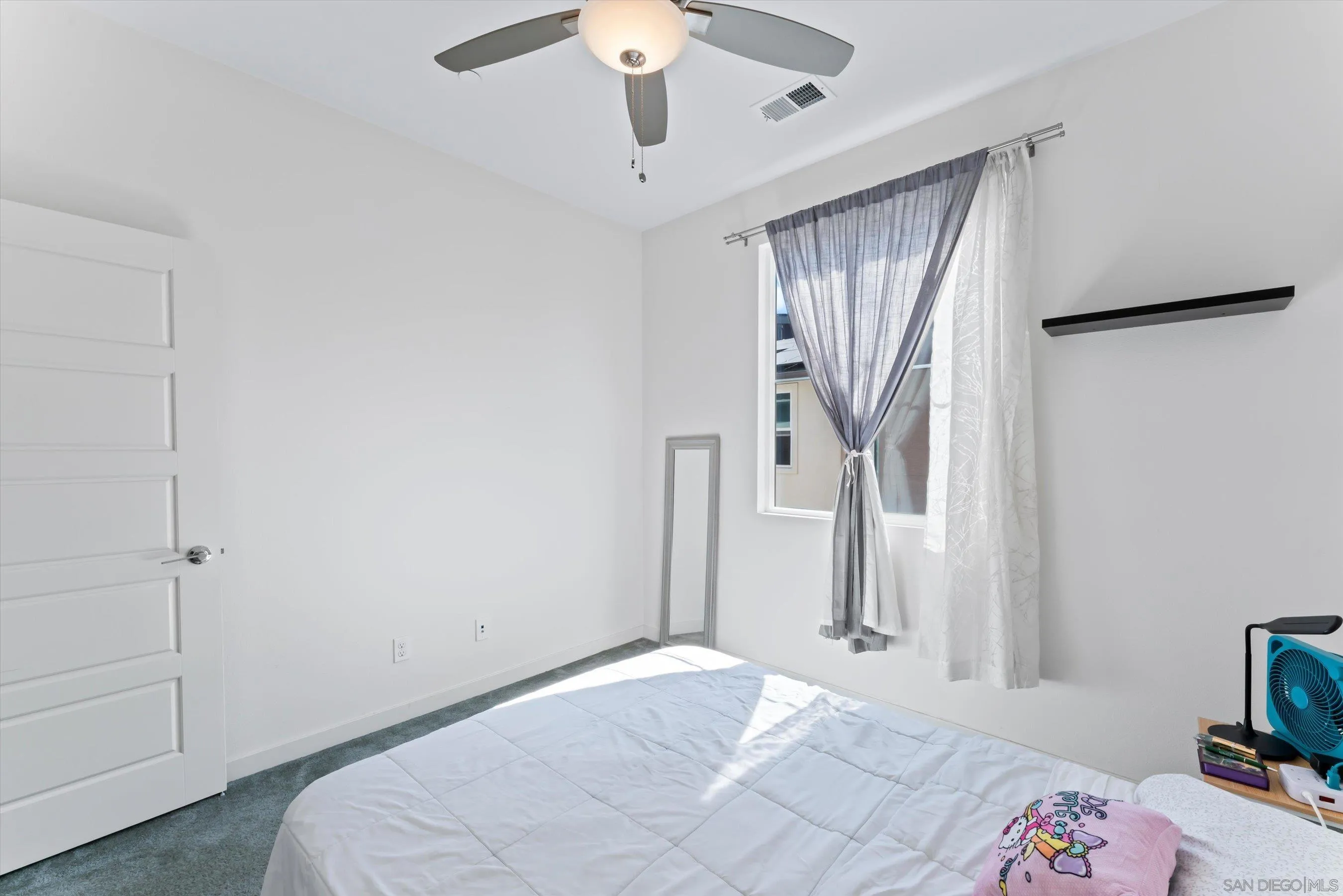 2275 Element Way, Unit 4 Chula Vista, CA 91915 - Photo 26 of 45 a bedroom with a bed and a chandelier