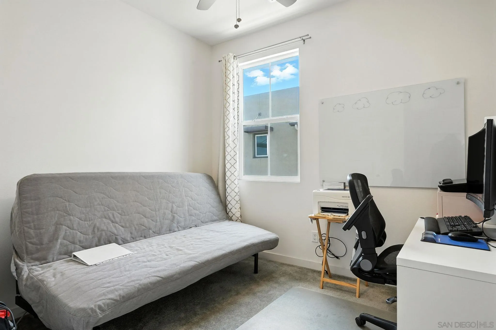 2275 Element Way, Unit 4 Chula Vista, CA 91915 - Photo 27 of 45 a bedroom with a bed and a window