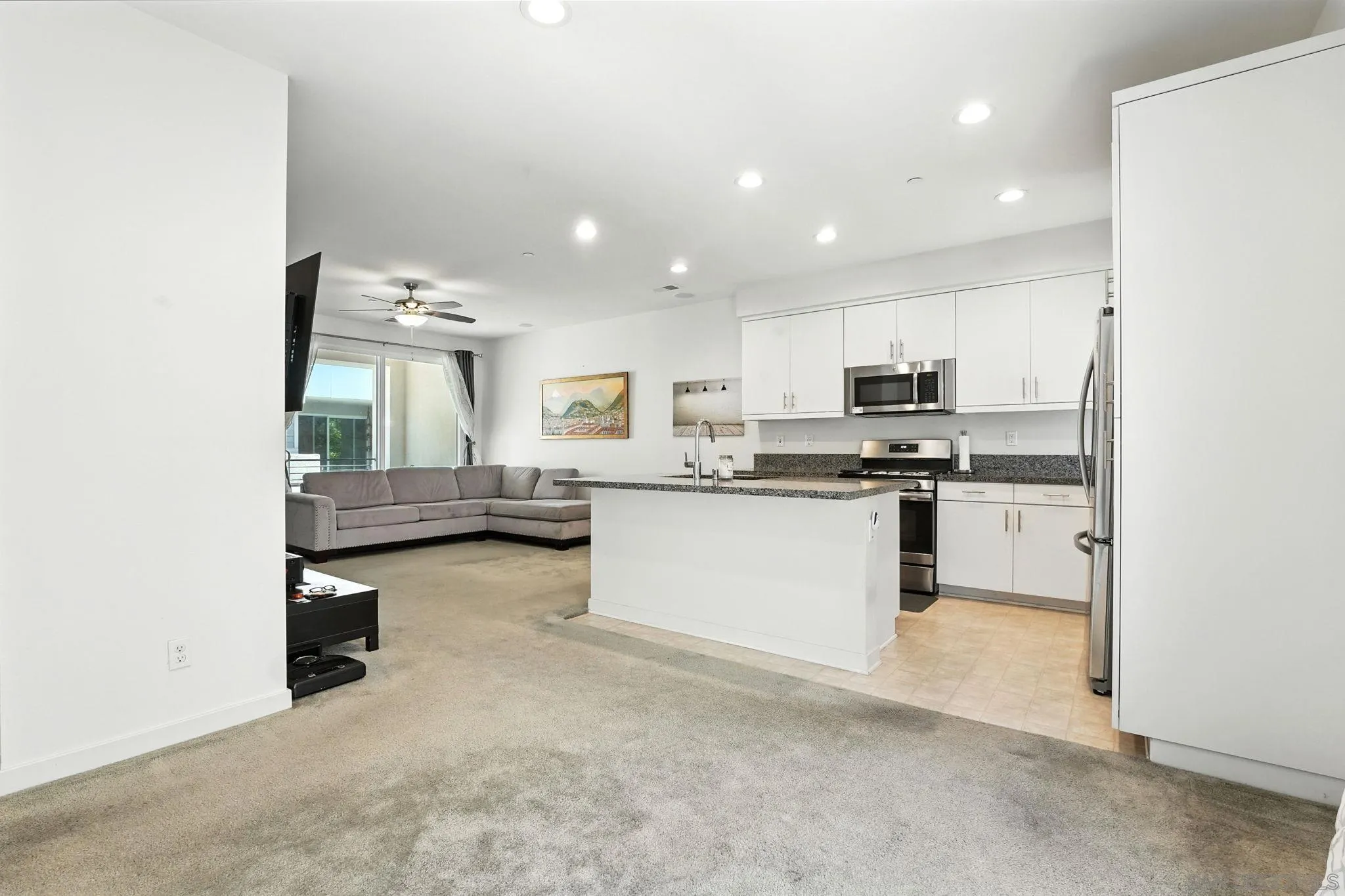 2275 Element Way, Unit 4 Chula Vista, CA 91915 - Photo 6 of 45 a kitchen with stainless steel appliances a stove a sink and a refrigerator