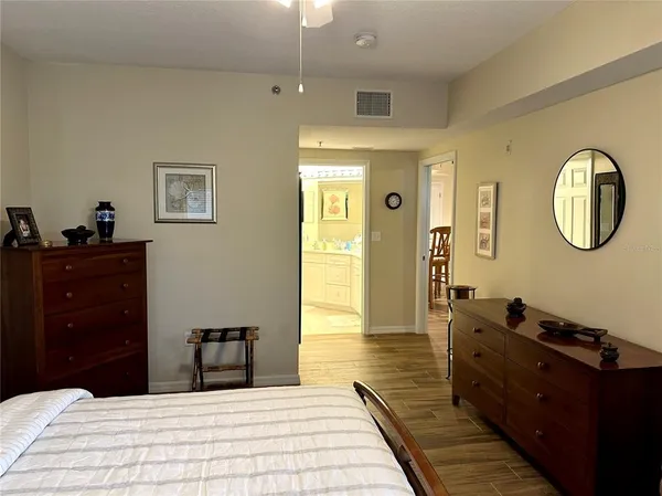a bedroom with a bed and a dresser