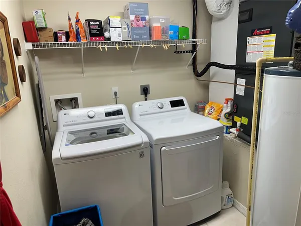 a utility room with dryer and washer