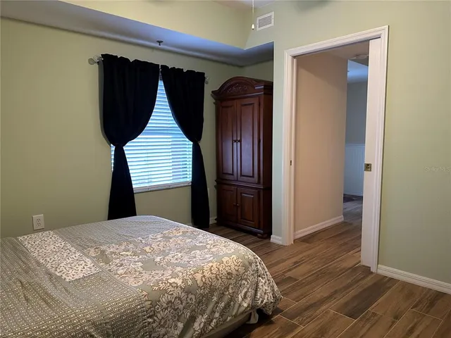 a bedroom with a bed and a closet