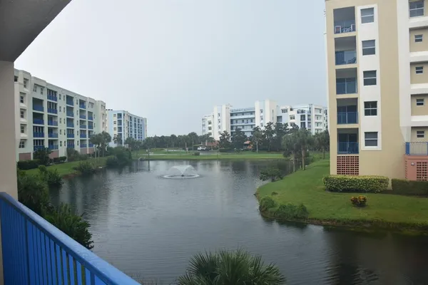 a view of a lake with a building and outdoor space