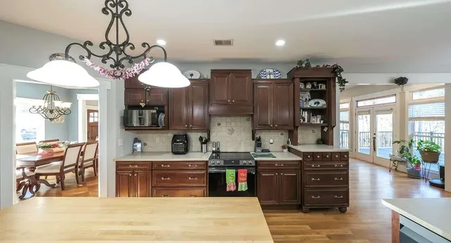 a living room with furniture fireplace and flat screen tv