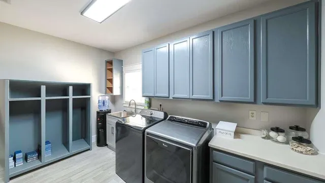 a bathroom with a double vanity sink mirror and shower