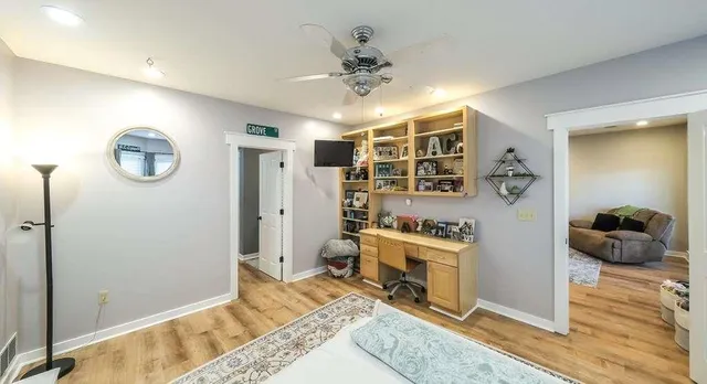 a bed room with a bed and a chandelier