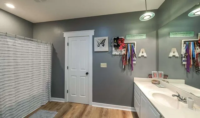 a bath tub sitting next to a window