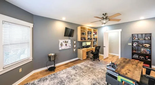 a view of a balcony with wooden floor and fence