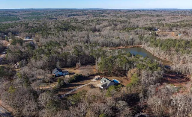 a room with dining table and chandelier