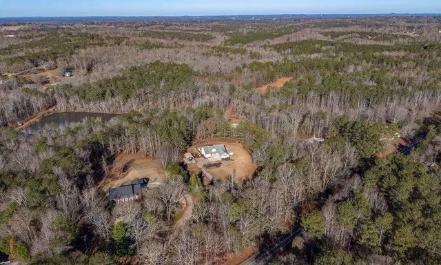 a dining room with furniture a chandelier and a rug