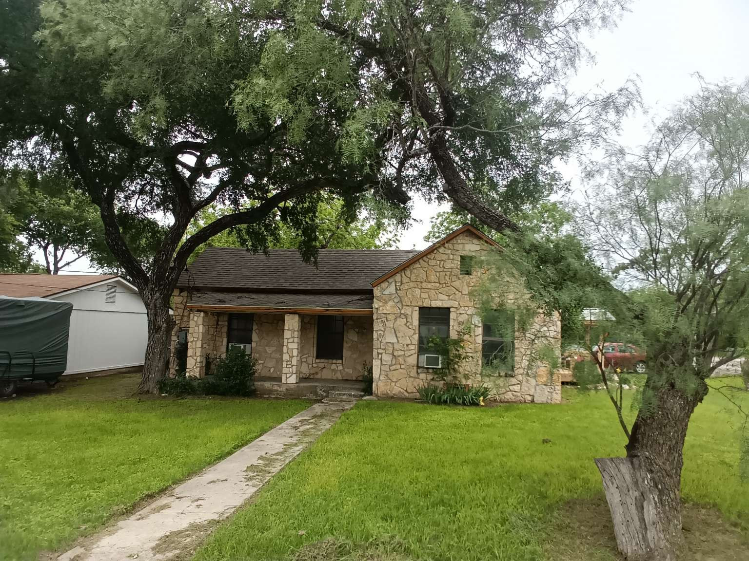 308 North Ridge Street Lampasas, TX 76550 - Photo 5 of 16 a front view of a house with a garden