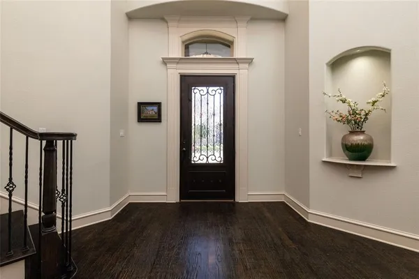 a view of entryway with wooden floor