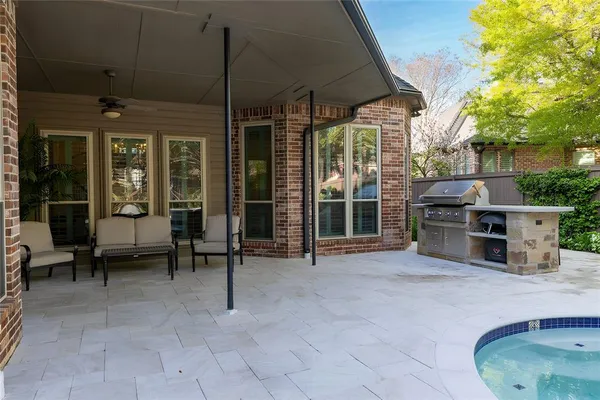 a view of a chairs and table in backyard