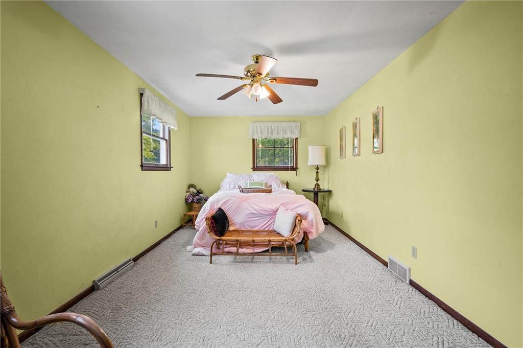 545 Bedford Road West Middlesex, PA 16159 - Photo 14 of 25 a spacious bedroom with a bed