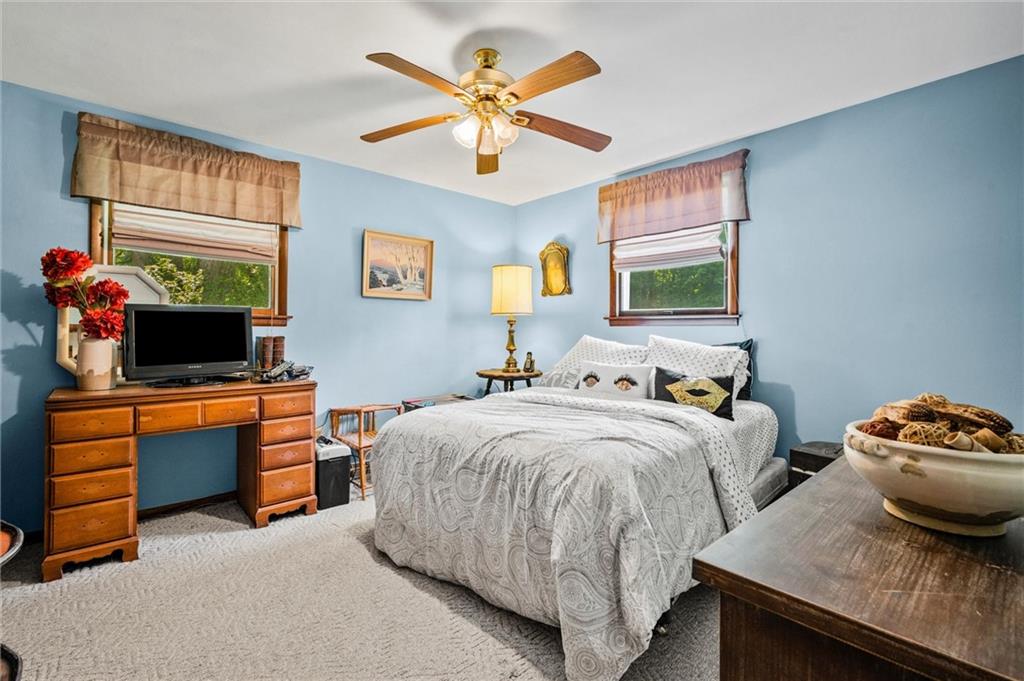 545 Bedford Road West Middlesex, PA 16159 - Photo 15 of 25 a bedroom with two beds and a flat screen tv