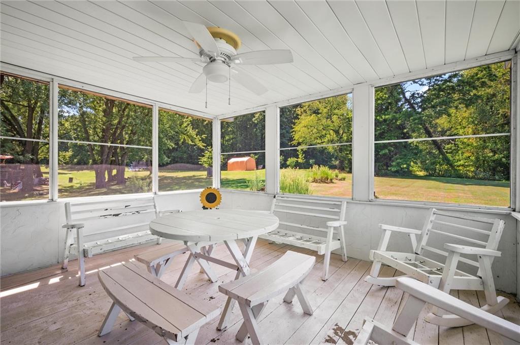 545 Bedford Road West Middlesex, PA 16159 - Photo 16 of 25 a view of a dining room with furniture large windows and wooden floor