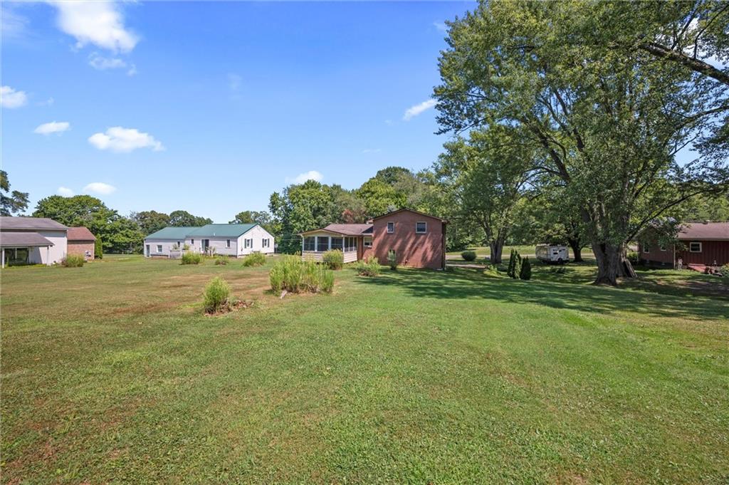 545 Bedford Road West Middlesex, PA 16159 - Photo 18 of 25 a view of a garden with a building in the background