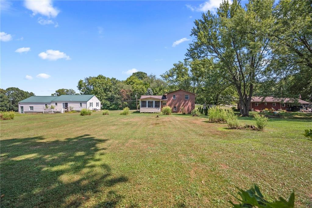 545 Bedford Road West Middlesex, PA 16159 - Photo 19 of 25 a view of an house with backyard space and balcony