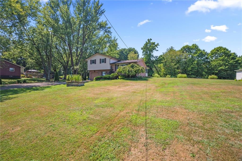 545 Bedford Road West Middlesex, PA 16159 - Photo 21 of 25 a view of a yard with a house in the background