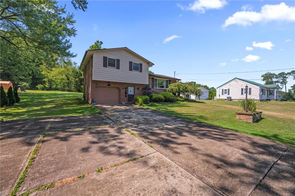 545 Bedford Road West Middlesex, PA 16159 - Photo 24 of 25 a front view of a house with garden