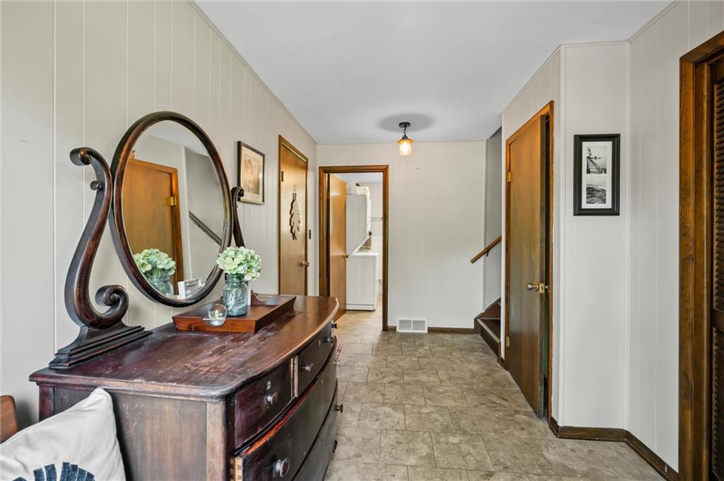 545 Bedford Road West Middlesex, PA 16159 - Photo 9 of 25 a bathroom with a granite countertop sink a mirror and a shower