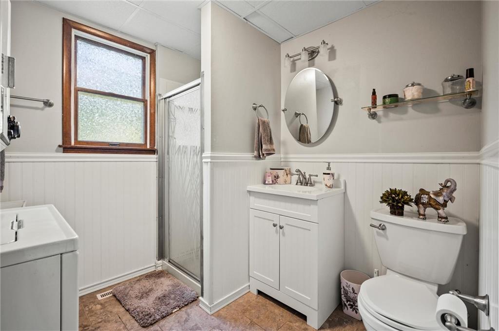 545 Bedford Road West Middlesex, PA 16159 - Photo 10 of 25 a bathroom with a toilet sink and mirror