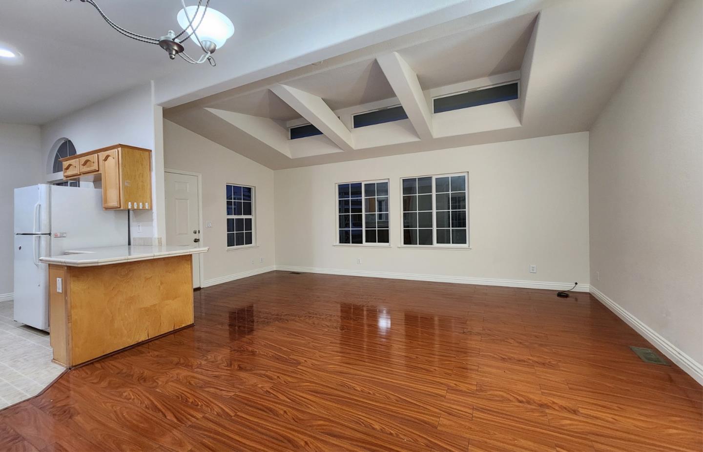 555 Umbarger Road, Unit 134 San Jose, CA 95111 - Photo 4 of 11 a view of empty room with wooden floor and fan