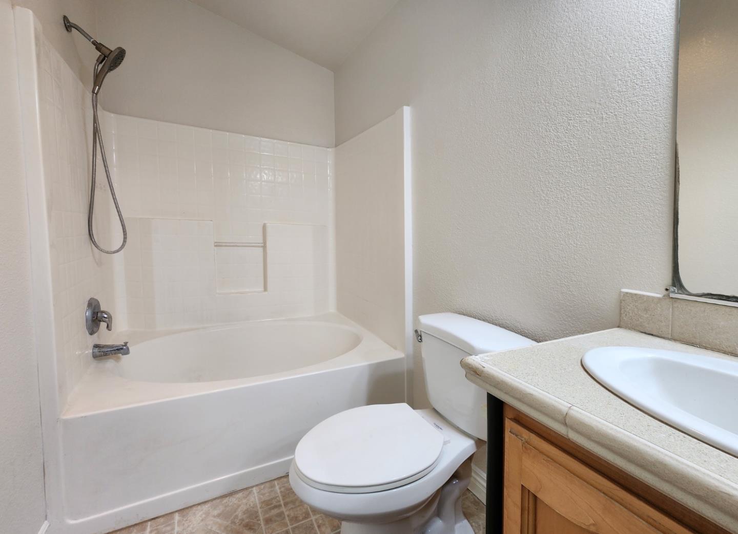 555 Umbarger Road, Unit 134 San Jose, CA 95111 - Photo 10 of 11 a white toilet sitting next to a bath tub
