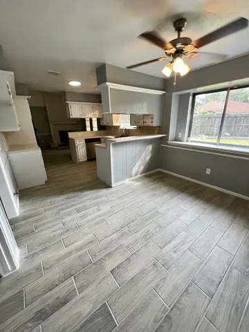 a view of kitchen with furniture and window