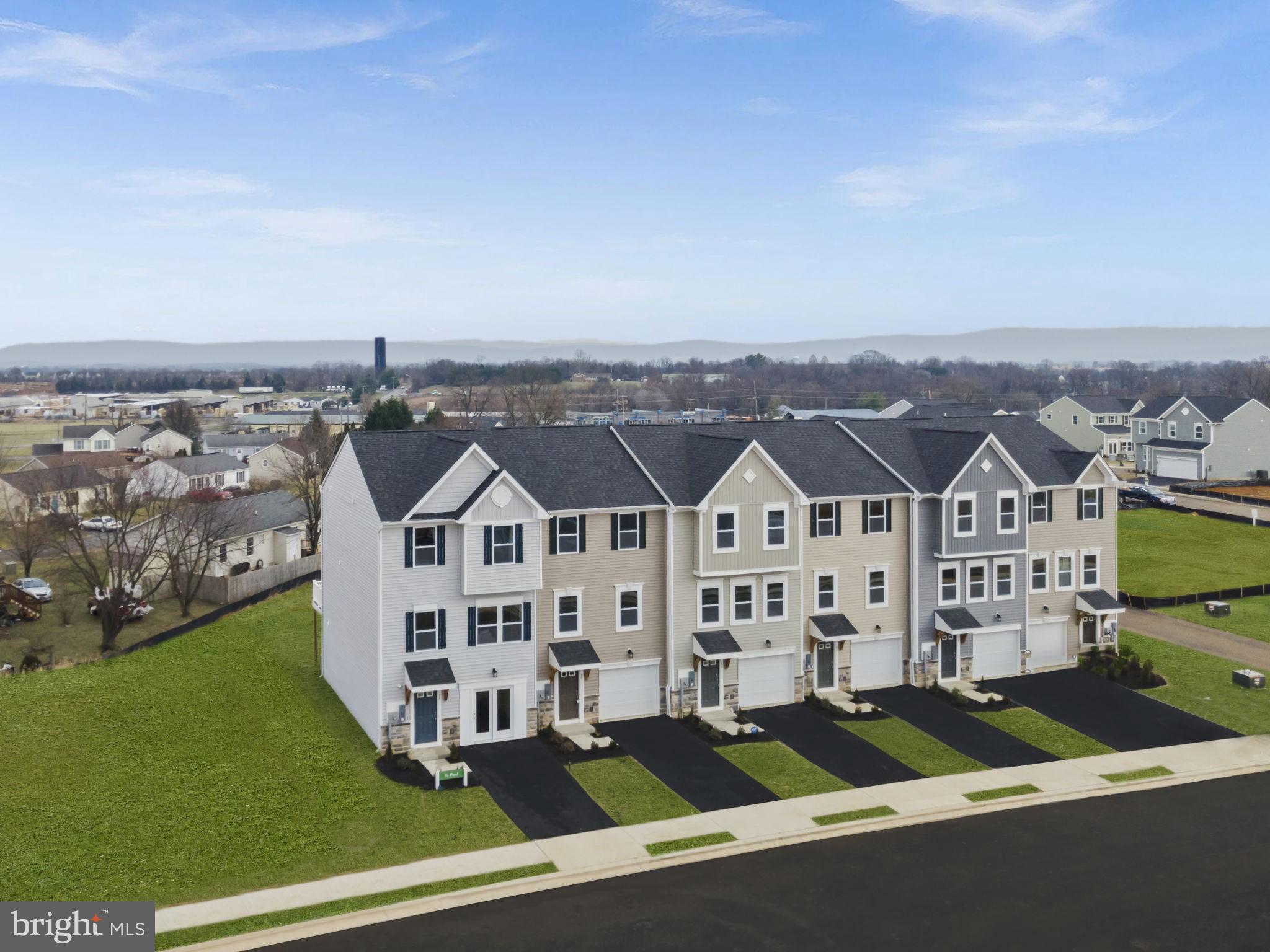 444 Zander Road Inwood, WV 25428 - Photo 3 of 14 a front view of a house with a yard