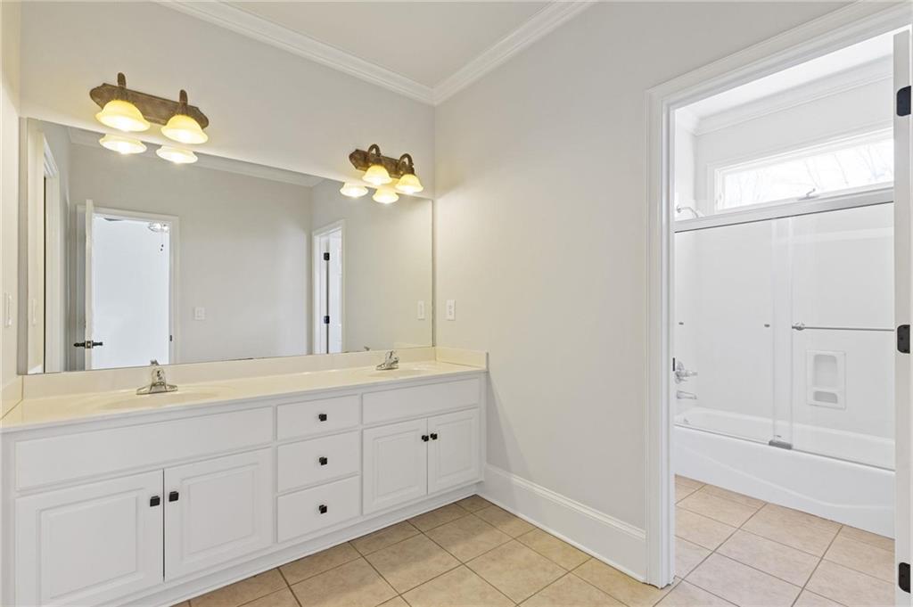 2010 Legends Way Braselton, GA 30517 - Photo 35 of 77 a bathroom with a double vanity sink mirror and bathtub