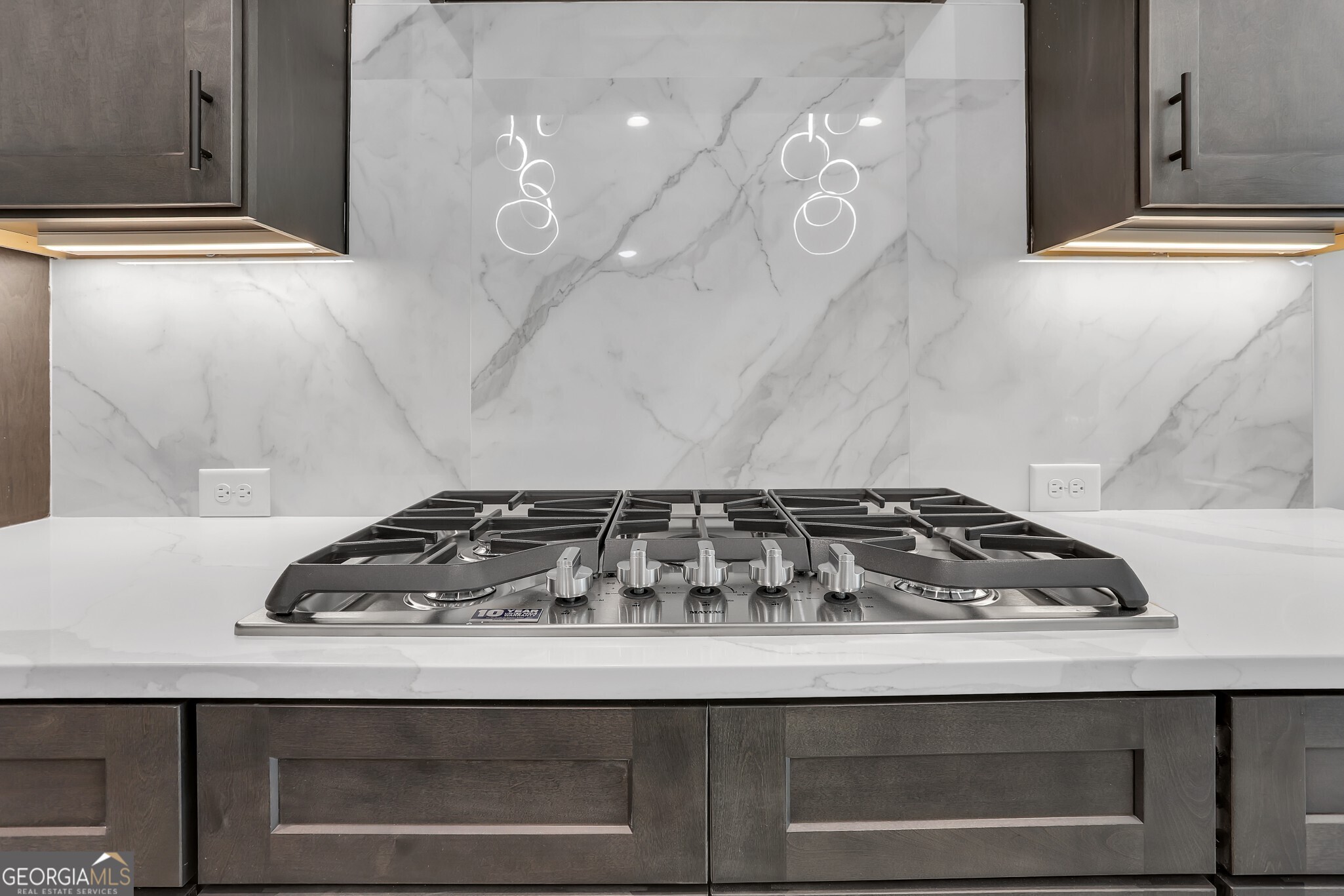 2043 Fischer Road Sharpsburg, GA 30277 - Photo 29 of 52 Gas cooktop, gorgeous backsplash and cabinet underlighting in the kitchen