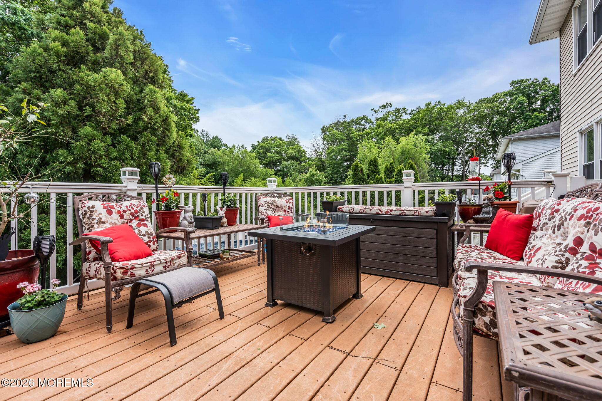 21 Ryan Road Marlboro, NJ 07746 - Photo 43 of 56 a view of deck with table and chairs a barbeque with wooden floor and fence