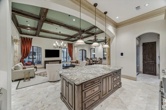 a kitchen with stainless steel appliances granite countertop a stove and a sink