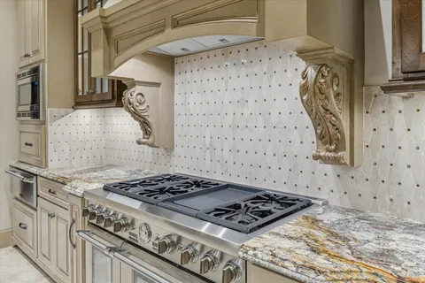a white stove top oven sitting inside of a kitchen