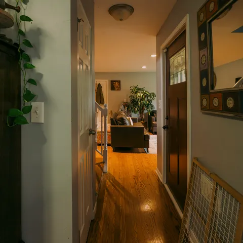 a view of a hallway and dining room