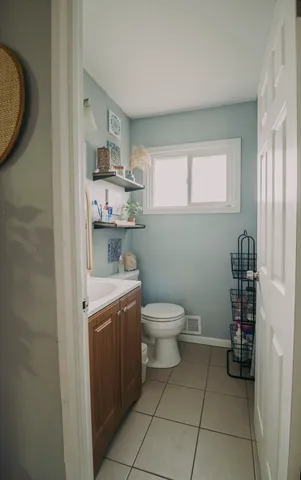 a bathroom with a toilet and a sink