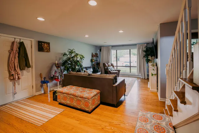 a living room with furniture bathtub and a flat screen tv